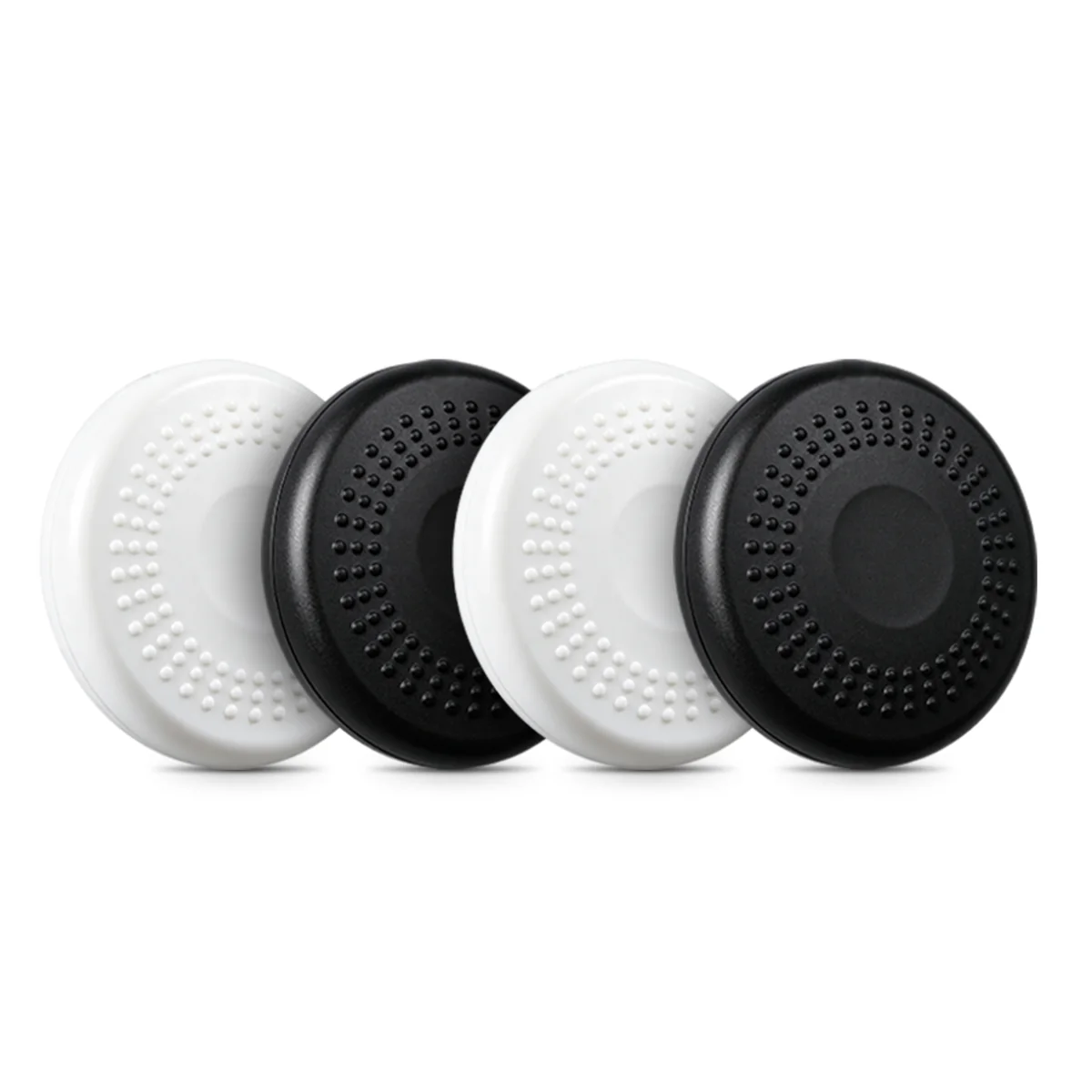 Four M06 round trackers in white and black, showing the textured anti-slip face
